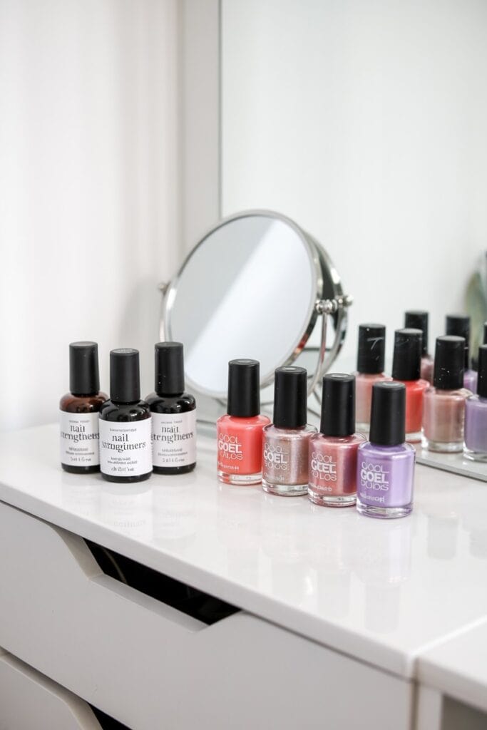 Non-formaldehyde nail strengthener being applied to short natural nails between gel manicures.