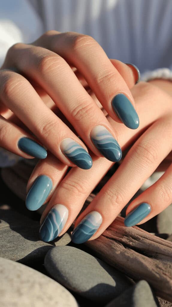 Muted dusty blue nails, minimal and elegant, subtle finish, clean white background